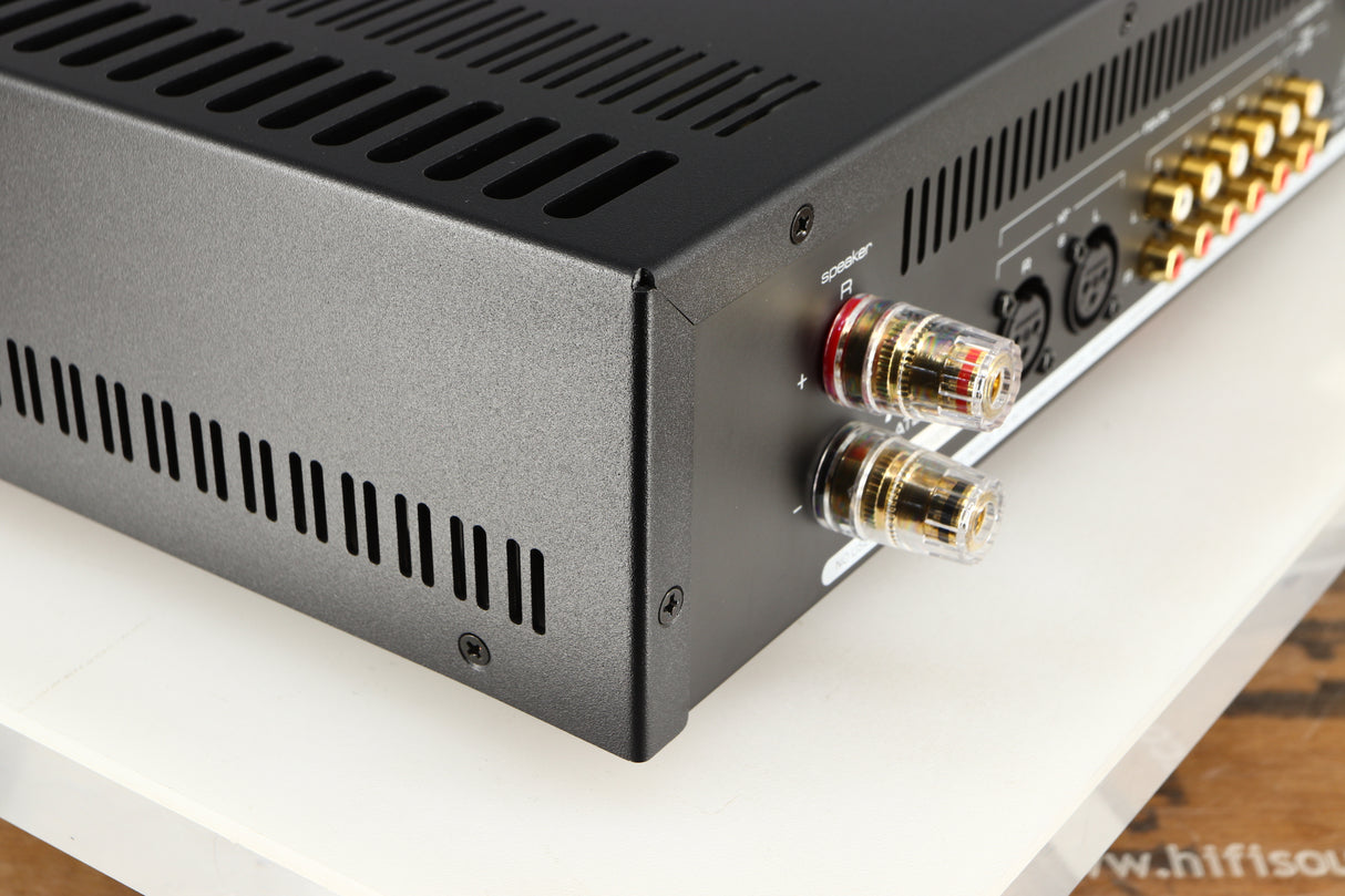 Rear right corner of a used Astin Trew AT2-2100 Integrated Amplifier in a red finish
