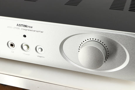 Close up of a used Astin Trew AT2-2100 Integrated Amplifier in a silver finish showing some of the fascia