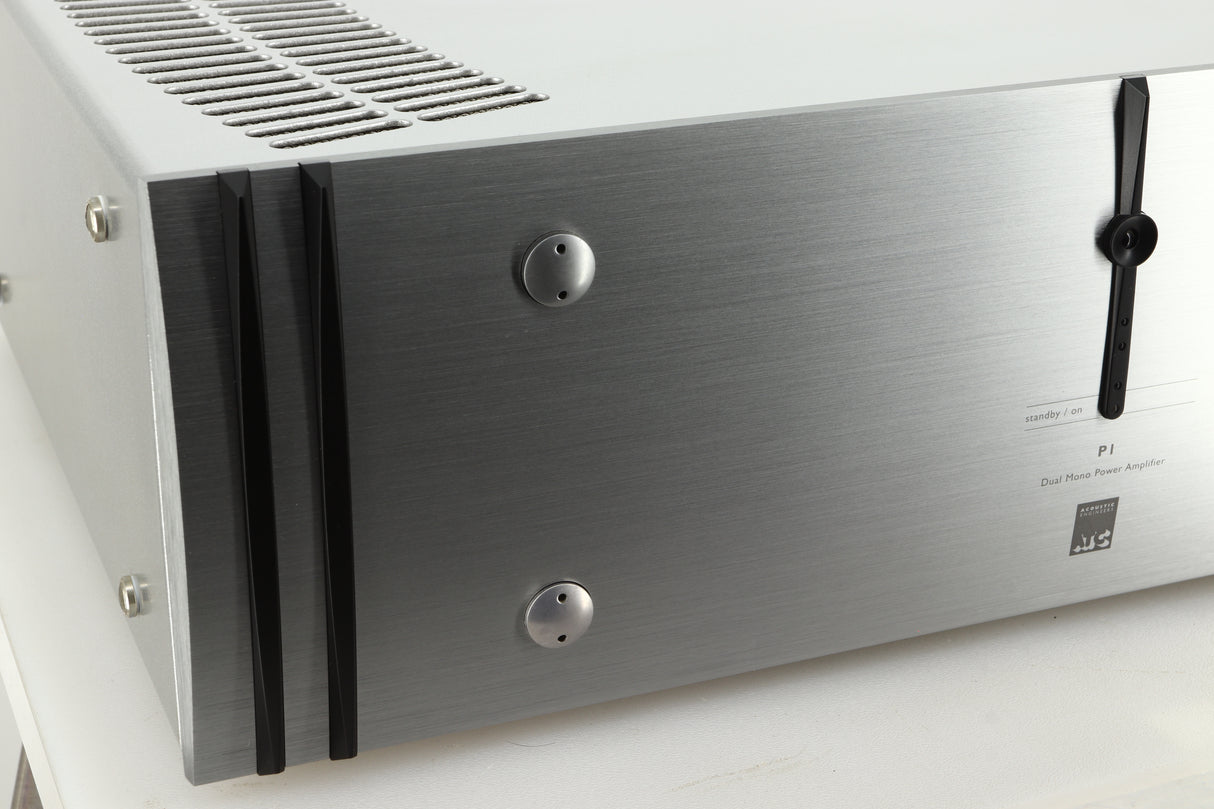 Close up view of a used ATC P1 Power Amplifier in silver finish showing the left side of the fascia