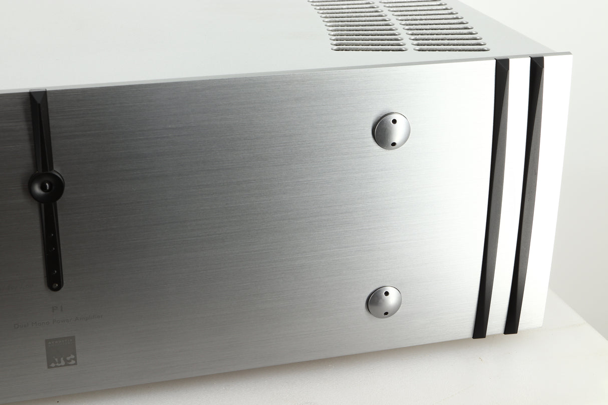 Close up view of a used ATC P1 Power Amplifier in silver finish showing the right side of the fascia