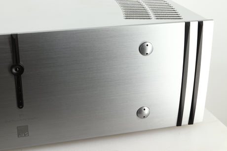 Close up view of a used ATC P1 Power Amplifier in silver finish showing the right side of the fascia