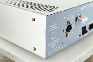 Rear left corner view of a used ATC P1 Power Amplifier in silver finish 