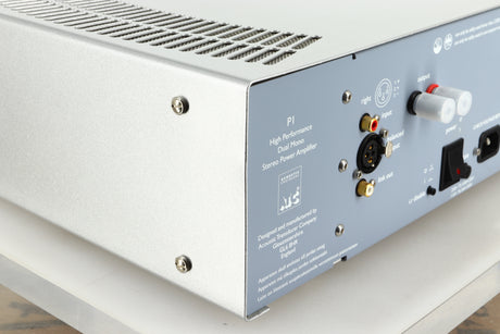 Rear left corner view of a used ATC P1 Power Amplifier in silver finish 