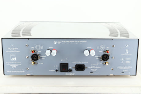 Rear view of a used ATC P1 Power Amplifier in silver finish showing Speaker outputs, mains, XLR, and RCA inputs