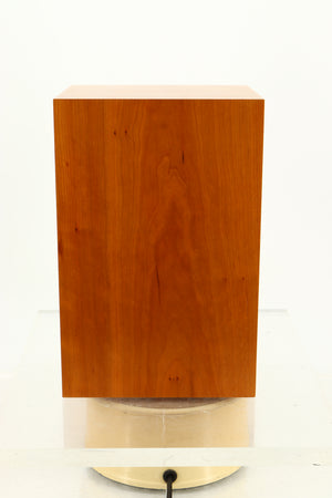 Side view of a used ATC SCM12 Standmount Speaker in Cherry finish