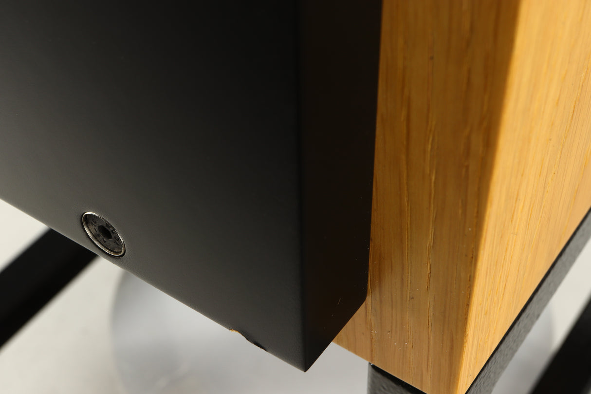 Close up of a used ATC SCM50SL Active Classic Standmount Speaker in a oak finish showing small blemish on fascia