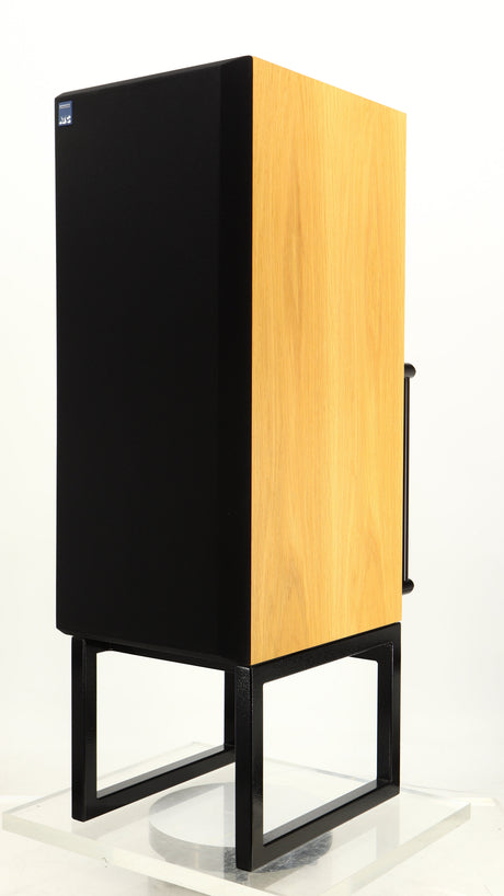 Front right corner of a used ATC SCM50SL Active Classic Standmount Speaker in a oak finish