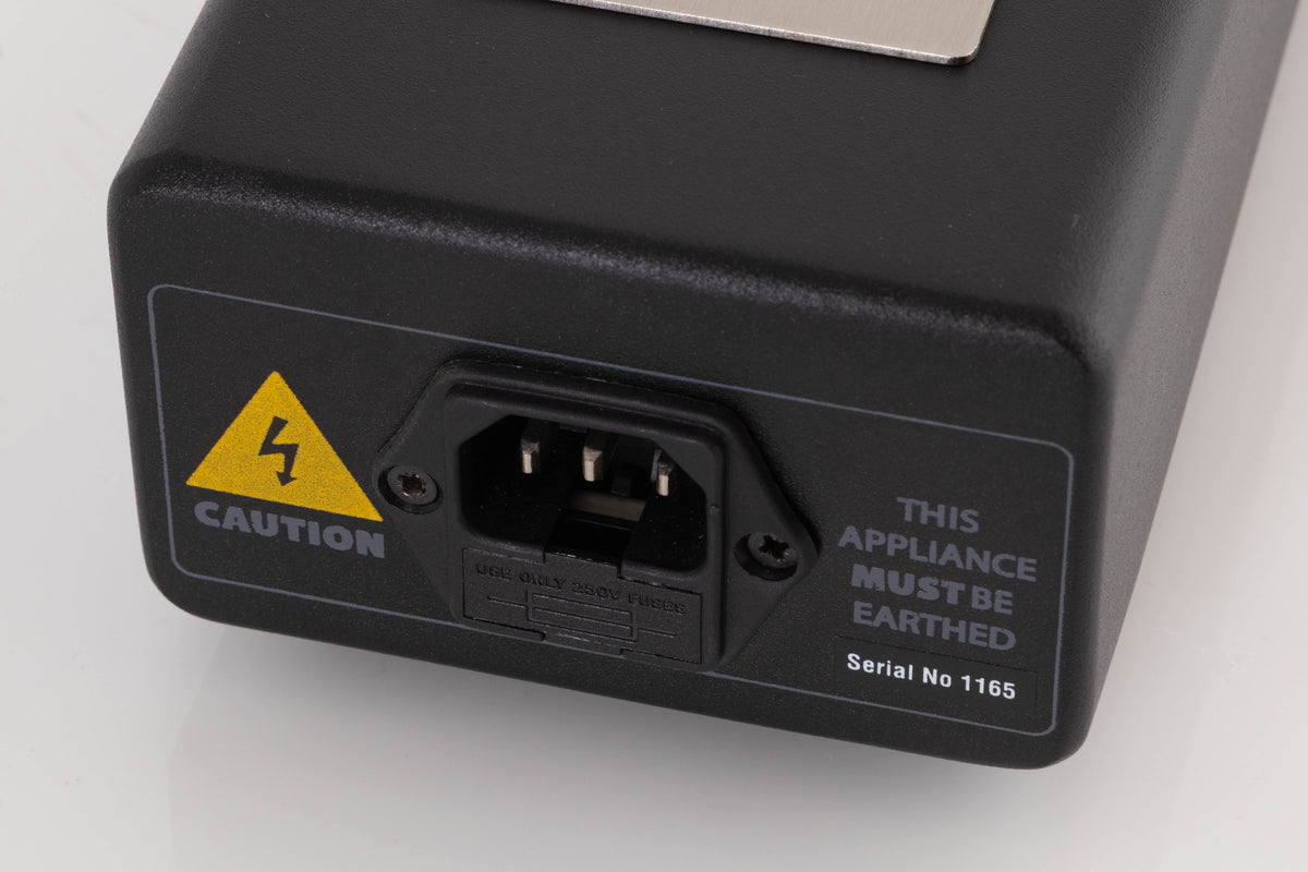 Close up of a used Atlas EOS Modular 4-Way Mains Block in a Black finish showing serial number