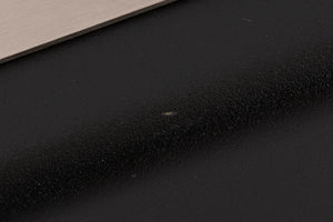 Close up of a used Atlas EOS Modular 4-Way Mains Block in a Black finish showing tiny scratch