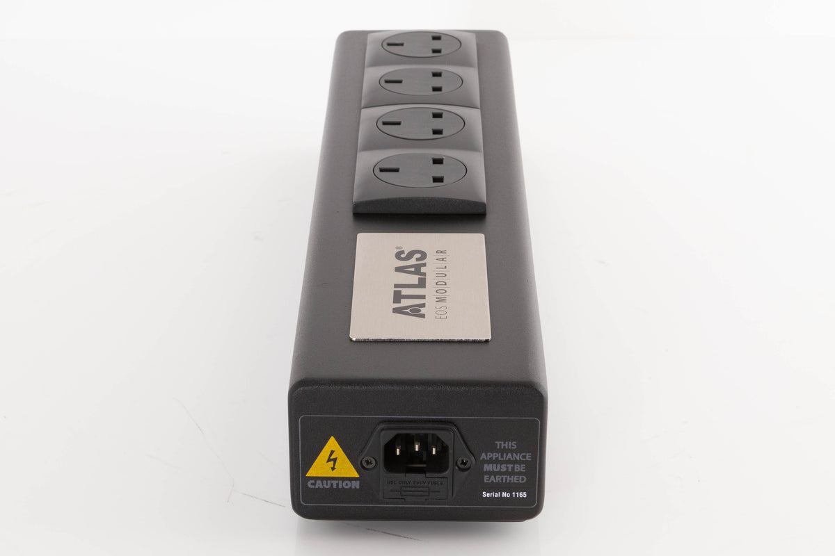Left side view of a used Atlas EOS Modular 4-Way Mains Block in a Black finish
