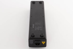 Underside of a used Atlas EOS Modular 4-Way Mains Block in a Black finish