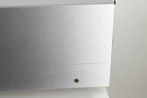 Close up view of a used Audio Research DSi200 Integrated Amplifier in silver finish showing a scratch on the right side near the back
