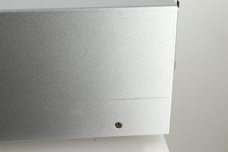 Close up view of a used Audio Research DSi200 Integrated Amplifier in silver finish showing a scratch on the right side near the back