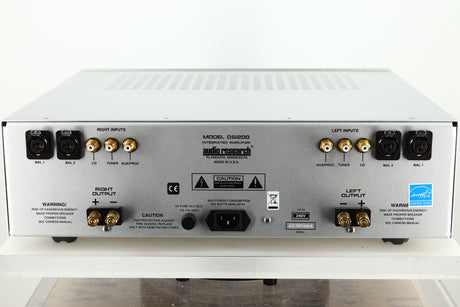 Rear view of a used Audio Research DSi200 Integrated Amplifier in silver finish showing Speaker outputs, balanced XLR, digital RCA, and Mains inputs