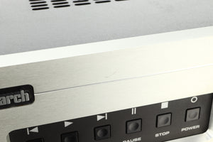 Close up view of a used Audio Research Reference CD8 CD Player in silver finish  showing a small scratch on the fascia above the play and pause buttons