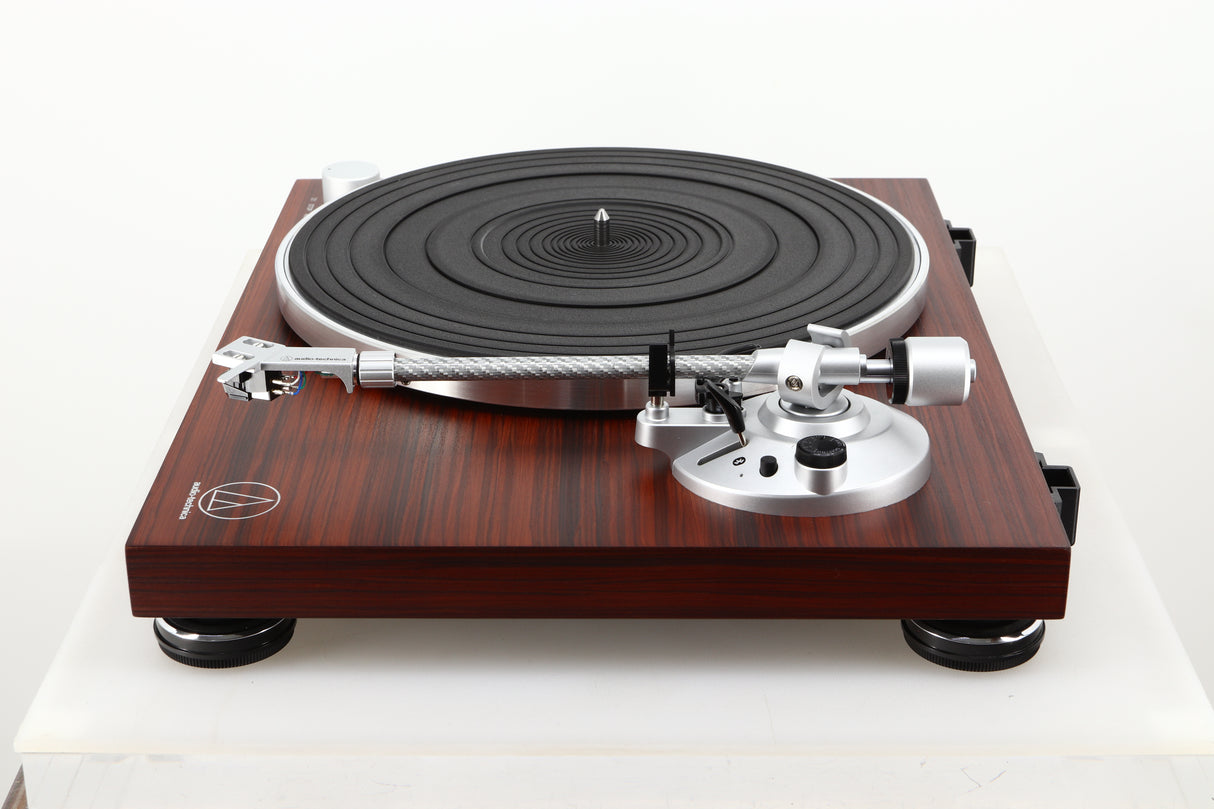 Side view of a used Audio Technica AT-LPW50BT Turntable in Rosewood finish 