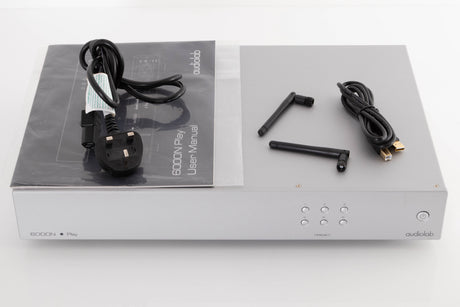 Top of a used Audiolab 6000N Play Network Streamer in a Silver finish showing Mains Cable, USB Cable, Manual and W-Fi Aerials