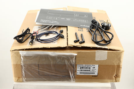 Box of a used Audiolab 6000N Streamer in Black finish showing Mains Cable, Manual, USB Cable, Optical Cable, and 2x Antenna