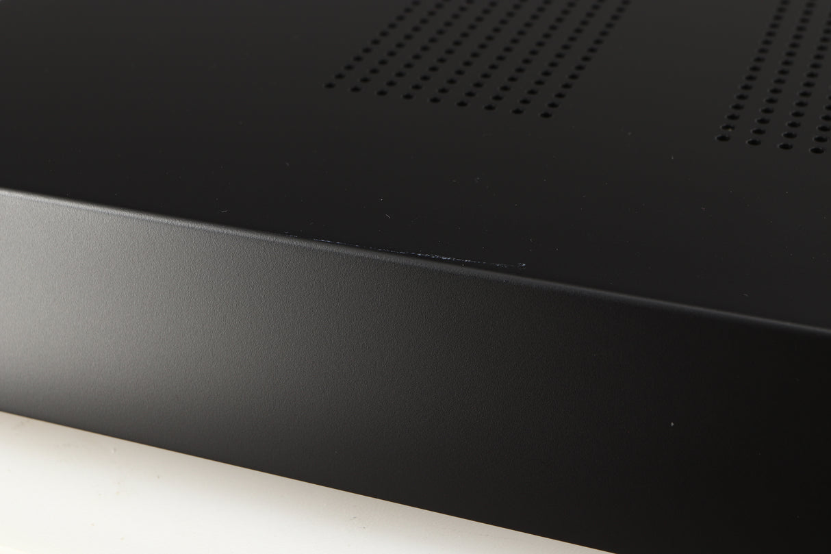 Close up of a used Audiolab 7000A Integrated Amplifier in a black finish showing white scratch on top