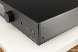 Front right corner of a used Audiolab 7000A Integrated Amplifier in a black finish