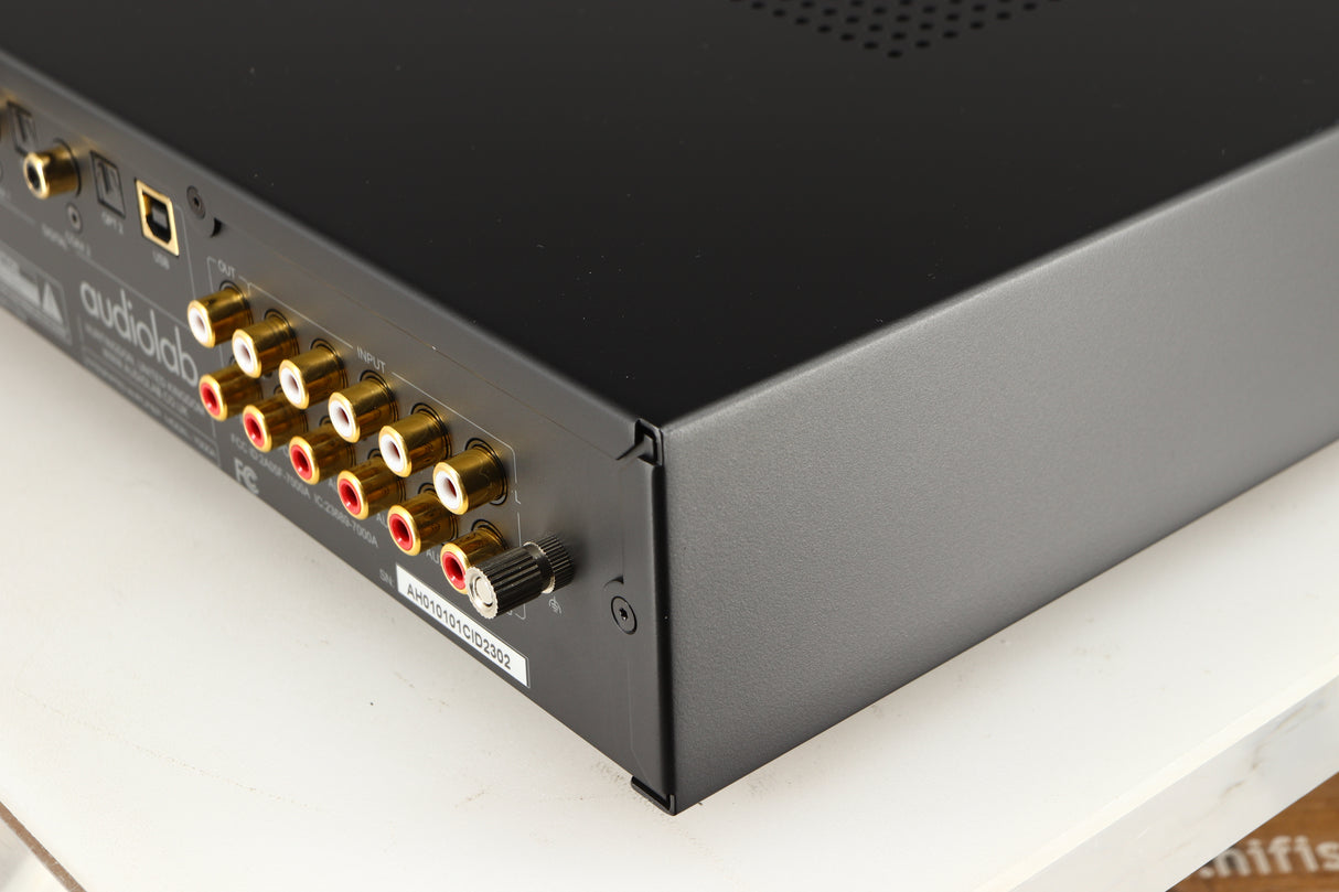 Rear left corner of a used Audiolab 7000A Integrated Amplifier in a black finish