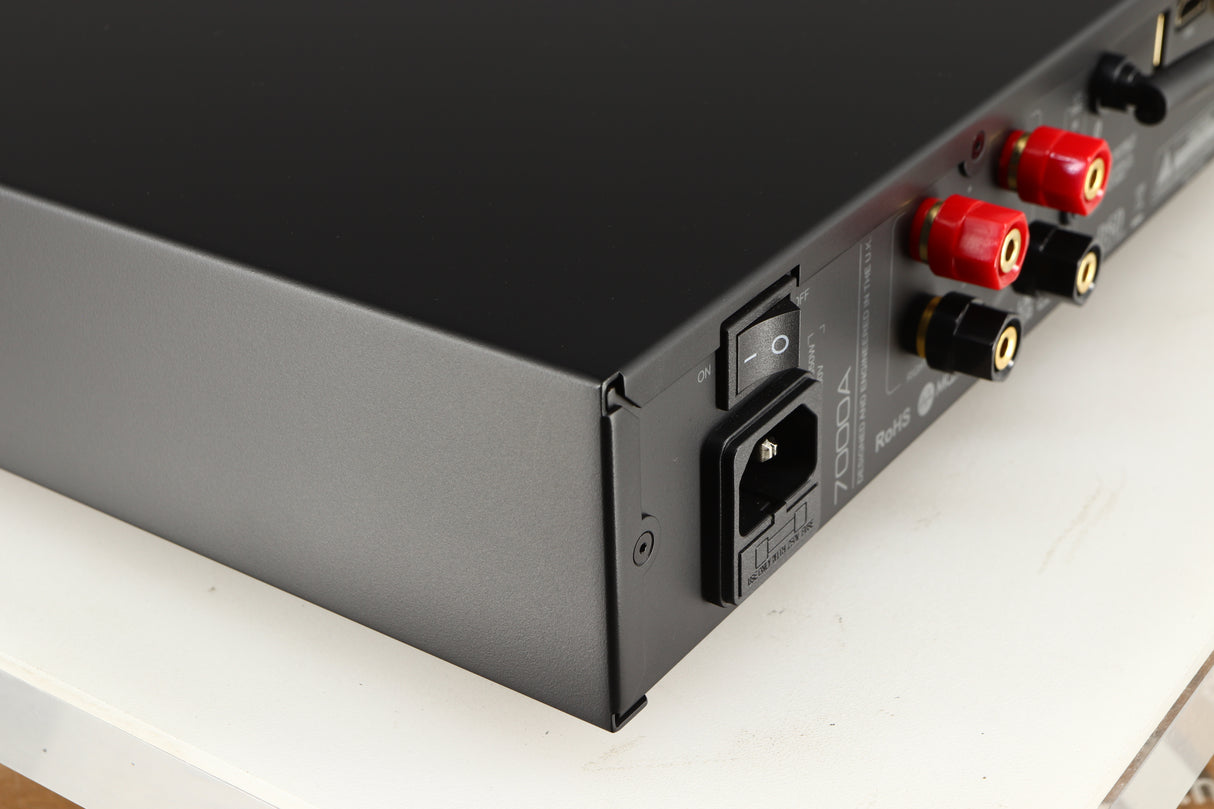 Rear right corner of a used Audiolab 7000A Integrated Amplifier in a black finish