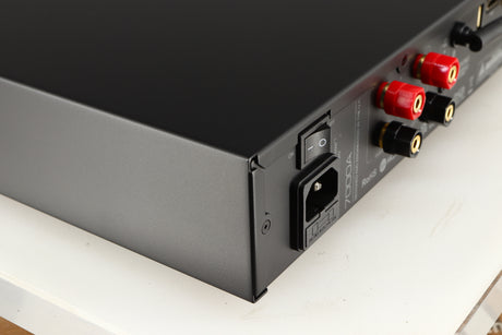 Rear right corner of a used Audiolab 7000A Integrated Amplifier in a black finish