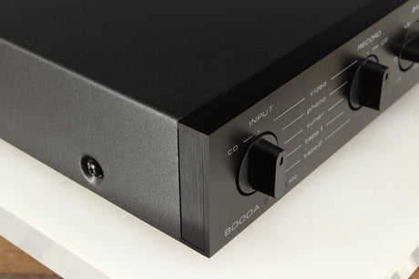 Front left corner of a used Audiolab 8000A Integrated Amplifier in a black finish