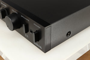 Front right corner of a used Audiolab 8000A Integrated Amplifier in a black finish