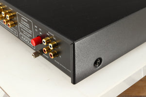 Rear left corner of a used Audiolab 8000A Integrated Amplifier in a black finish
