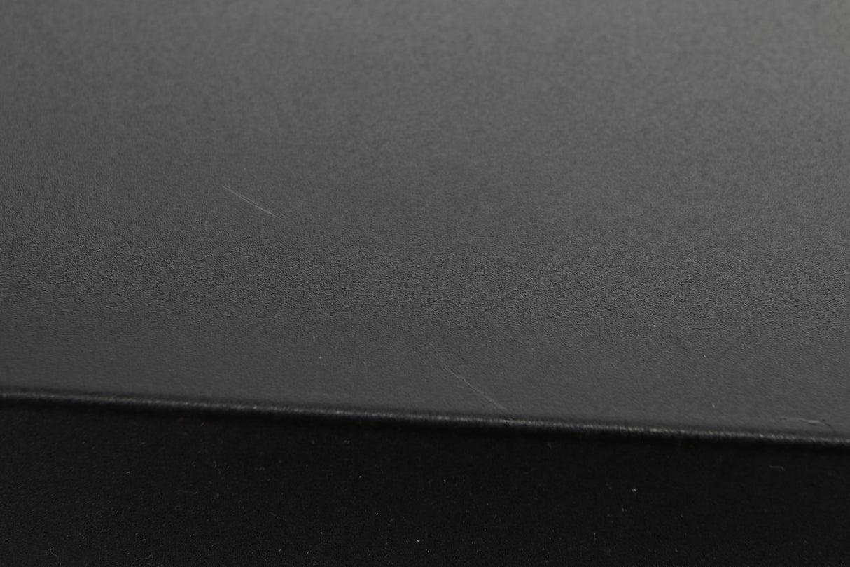 Close up view of a used Audiolab 8000C Pre Amplifier in Black finish showing scratching on the top 