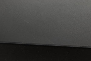 Close up view of a used Audiolab 8000C Pre Amplifier in Black finish showing scratching on the top 
