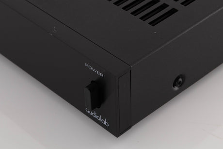 Front right corner of a used Audiolab 8000P Power Amplifier in a Black finish