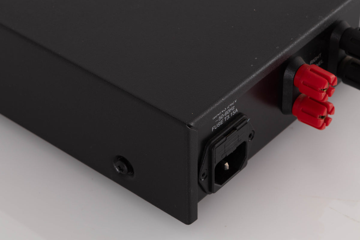 Rear right corner of a used Audiolab 8000P Power Amplifier in a Black finish