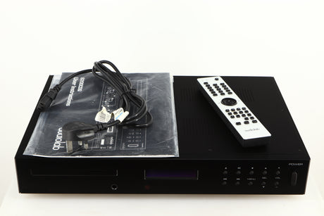 Top of a used Audiolab 8200CDQ CD Player in a black finish showing Mains Cable, Remote and Manual