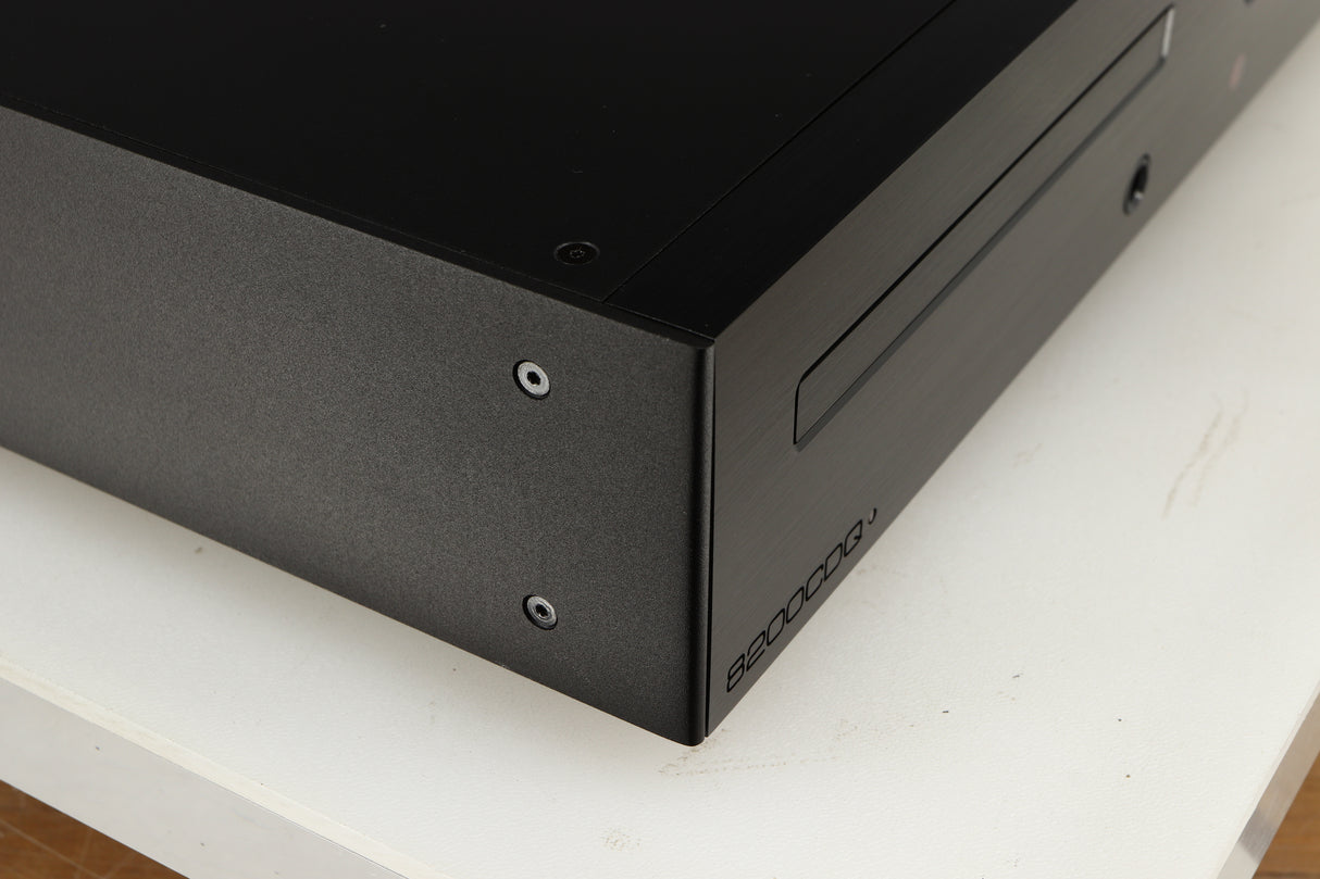 Close up of a used Audiolab 8200CDQ CD Player in a black finish showing very minor scratching on left side 
