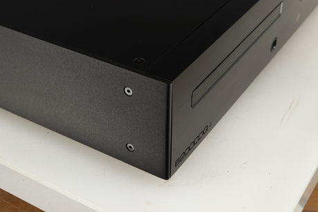 Close up of a used Audiolab 8200CDQ CD Player in a black finish showing very minor scratching on left side 