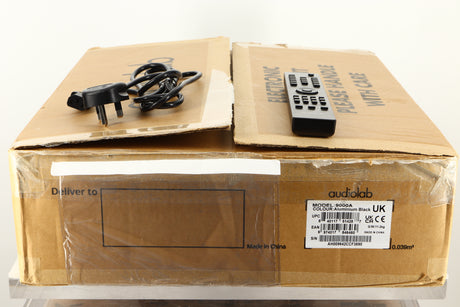 Box of a used Audiolab 9000A Integrated Amplifier in Black finish with mains cable and remote