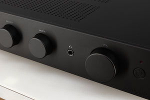 Close up of a used Audiolab 9000A Integrated Amplifier in a black finish showing some of the fascia