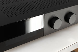 Close up of a used Audiolab 9000A Integrated Amplifier in a black finish showing the screen