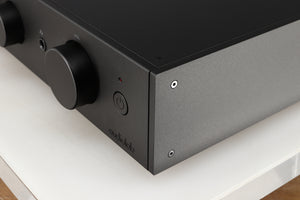 Front right corner of a used Audiolab 9000A Integrated Amplifier in a black finish