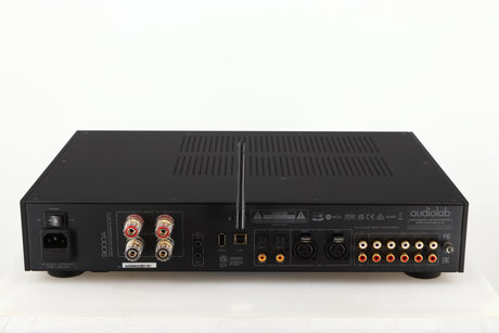 Rear view of a used Audiolab 9000A Integrated Amplifier in a black finish showing Phono Inputs and Outputs, Mains Input, Speaker Output and Optical Input