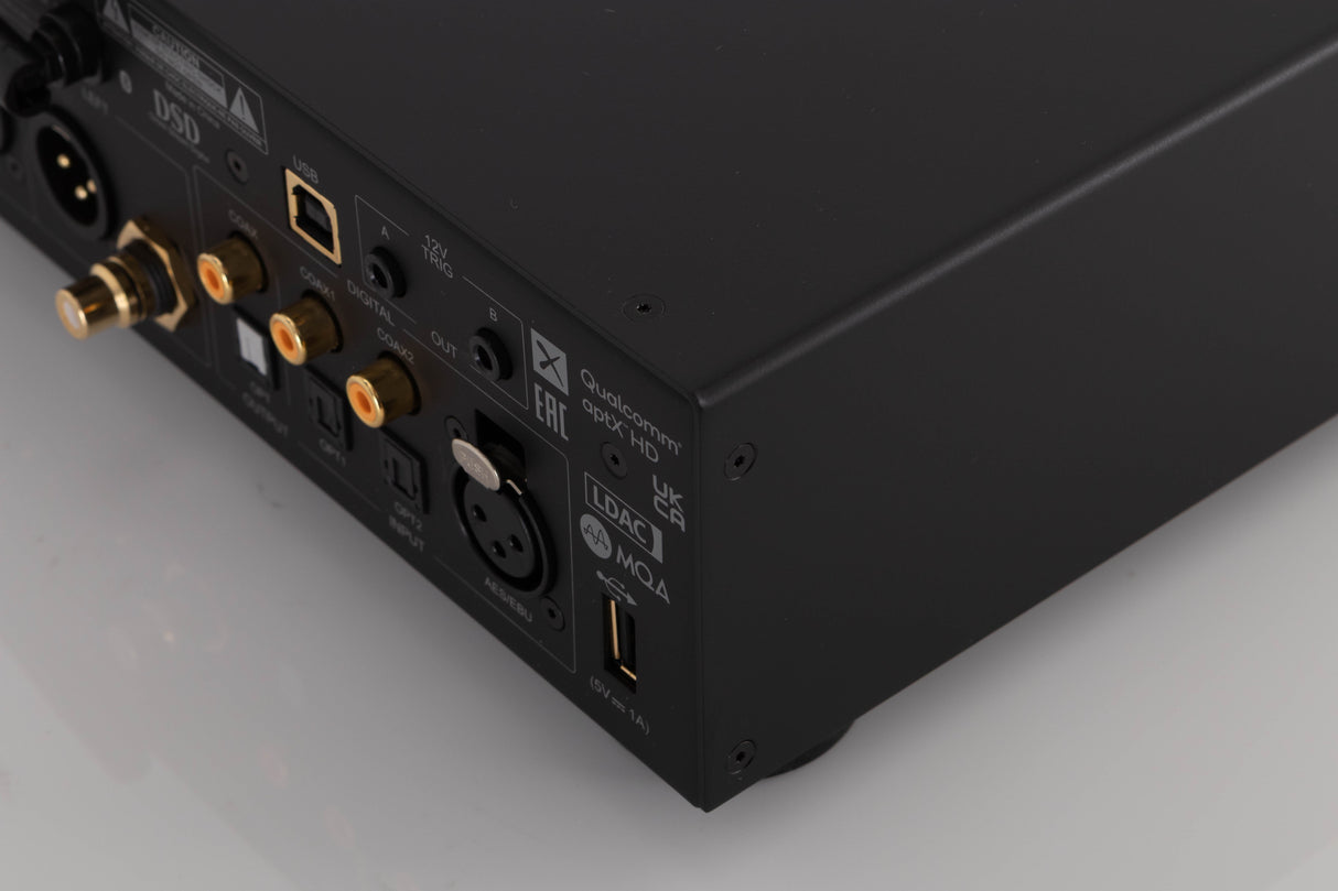 Rear left corner of a used Audiolab D9 Digital Analogue Converter in a Black finish