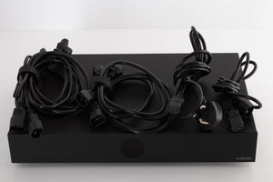 Top of a used Audiolab DC Block 6 in a Black finish showing Power Cables and Mains Cable