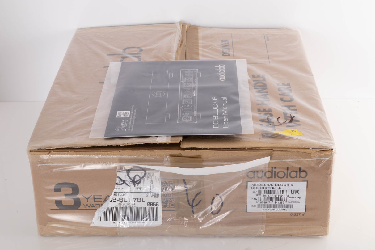 Box for a used Audiolab DC Block 6 in a Black finish showing Manual