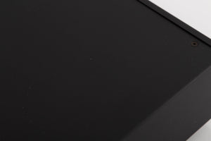 Close up of a used Audiolab DC Block 6 in a Black finish showing some scratches on top