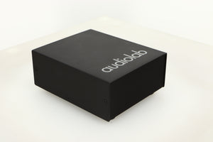 Front left corner view of a used Audiolab DC Block Mains Filter in Black finish