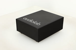 Front right corner view of a used Audiolab DC Block Mains Filter in Black finish