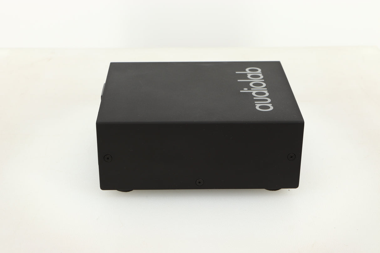 Side view of a used Audiolab DC Block Mains Filter in Black finish