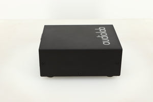 Side view of a used Audiolab DC Block Mains Filter in Black finish